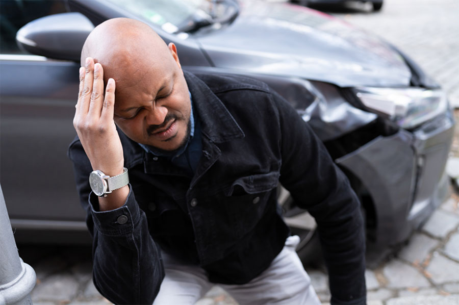 Brain Injuries photo of man with hand on head