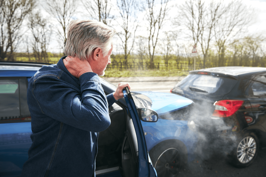 Personal injury man with hurt neck after a fender bender car accident crash